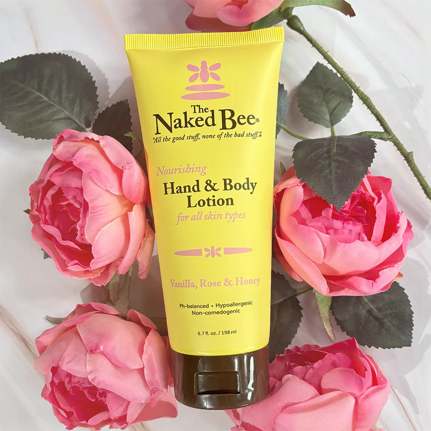 Naked Bee hand and body lotion tube with pink roses on a white background