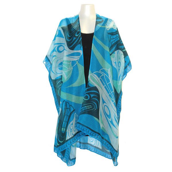 Blue and green patterned scarf on a mannequin against a white background