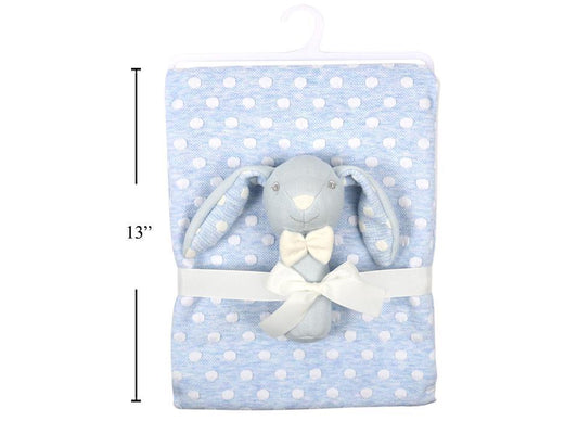 A folded baby blanket in light blue with white polka dots, wrapped with a white ribbon and featuring a plush gray bunny toy with a cream bow. A black vertical measurement line on the left indicates 13 inches.