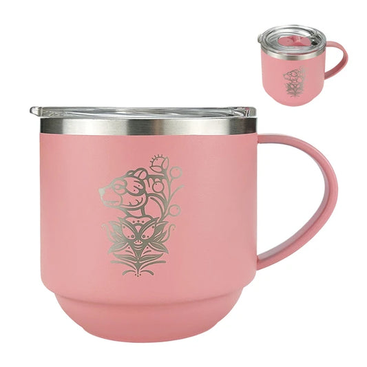 Pink insulated mug with floral design on a white background