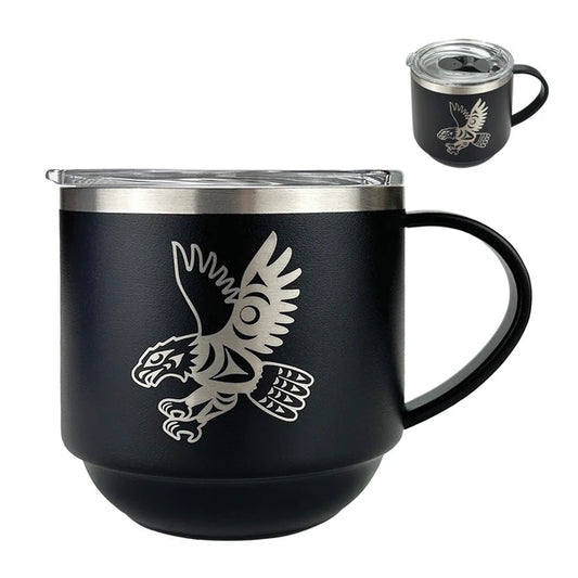 Black mug with a metallic eagle design on a white background