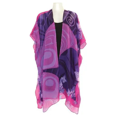 Pink and purple patterned scarf on a mannequin against a white background