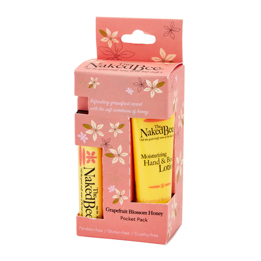 Naked Bee hand and lip balm set in pink packaging with floral designs on a white background