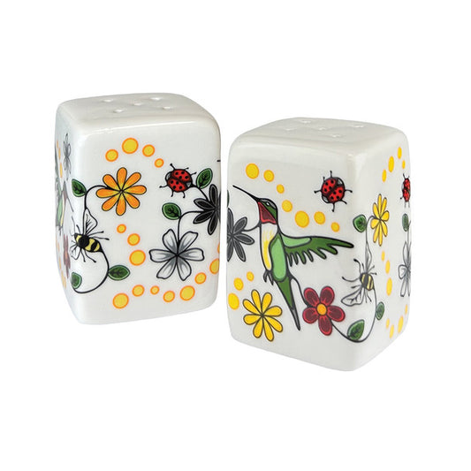 Two ceramic salt and pepper shakers with floral and insect designs on a white background