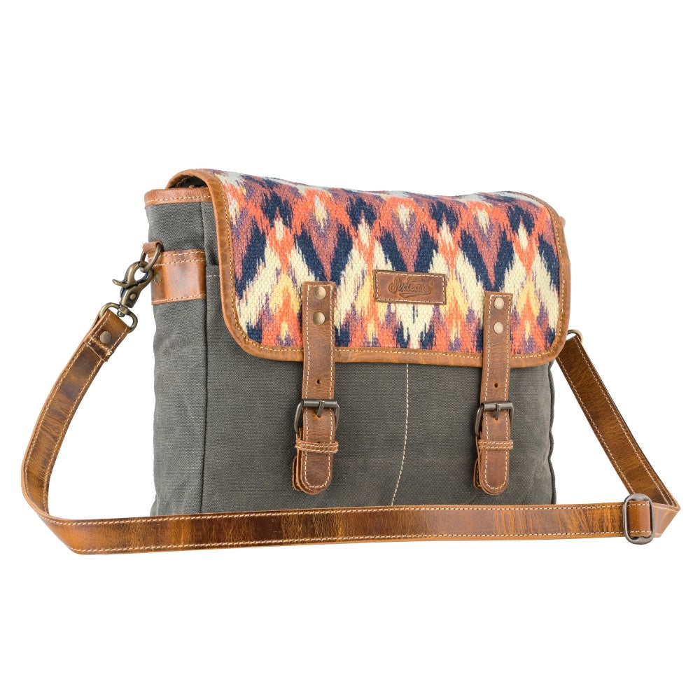 Gray bag with a colorful patterned flap on a white background