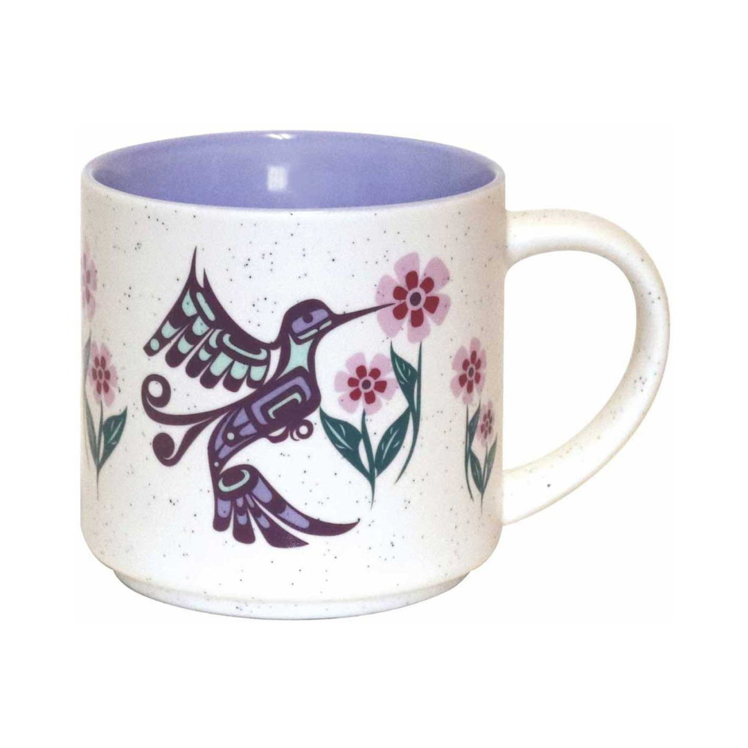 Mug with a hummingbird and floral design on a white background