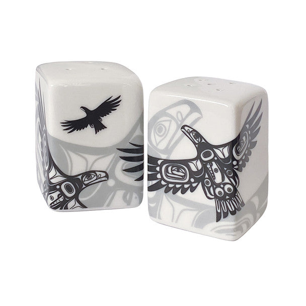 Two ceramic salt and pepper shakers with bird designs on a white background