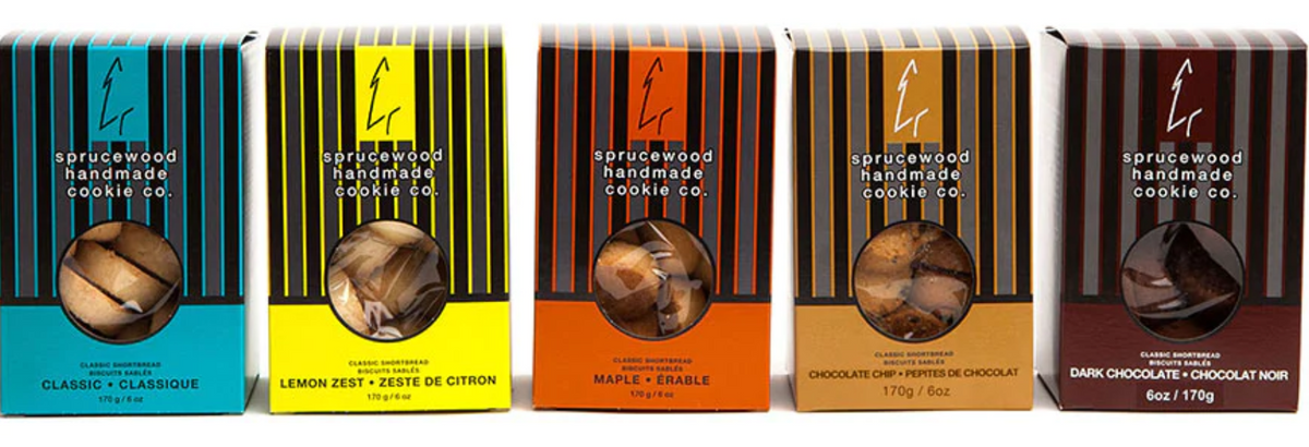 Row of boxes from a cookie company with different flavors on a white background